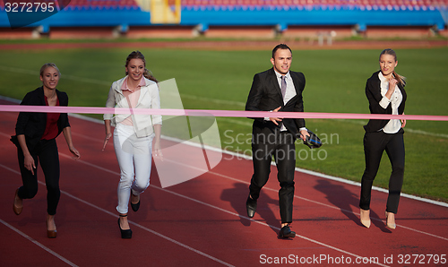 Image of business people running on racing track