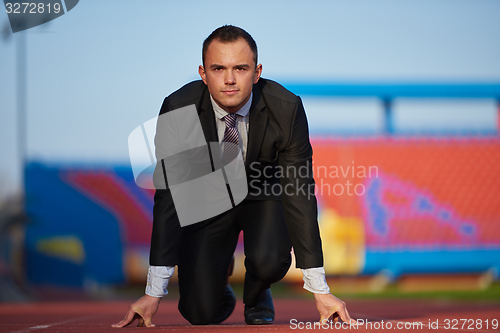 Image of business man ready to sprint