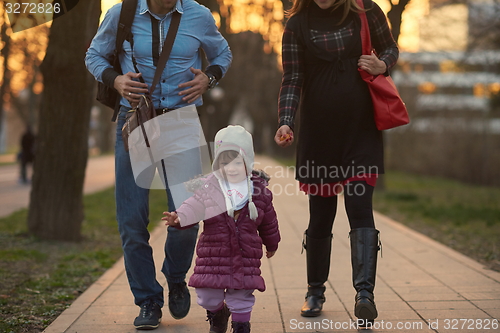 Image of young pregnant couple have fun and relax