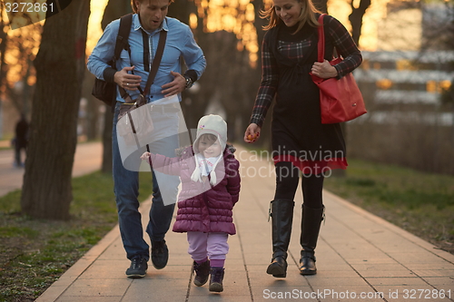 Image of young pregnant couple have fun and relax