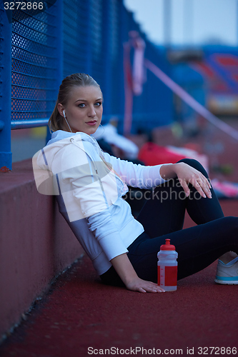 Image of sporty woman on athletic race track