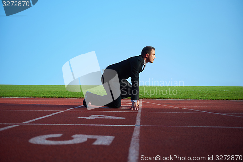 Image of business man ready to sprint