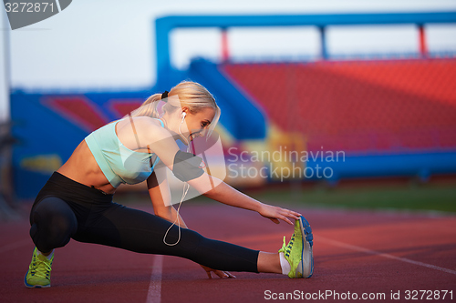 Image of sporty woman on athletic race track