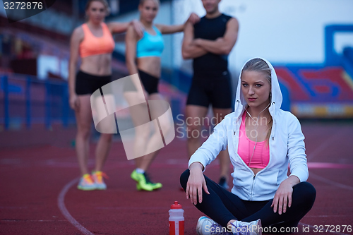 Image of sporty woman on athletic race track