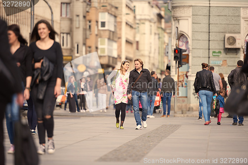 Image of young pregnant couple have fun and relax