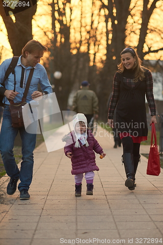 Image of young pregnant couple have fun and relax