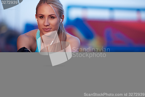 Image of sporty woman on athletic race track