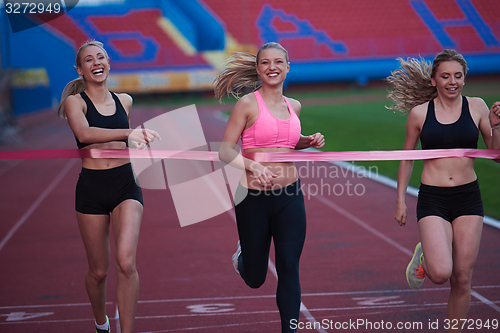 Image of Female Runners Finishing Race Together