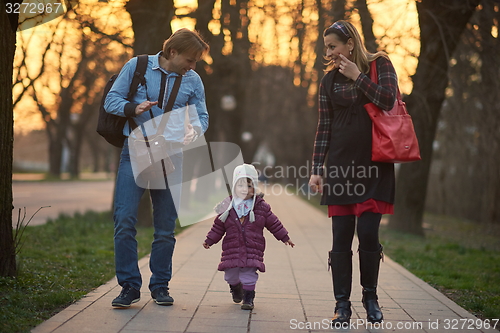 Image of young pregnant couple have fun and relax