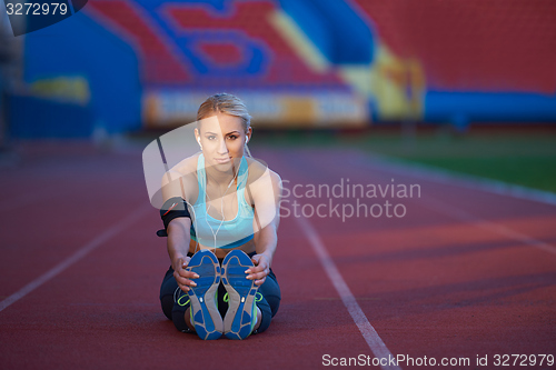 Image of sporty woman on athletic race track