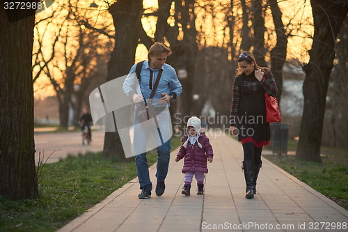 Image of young pregnant couple have fun and relax