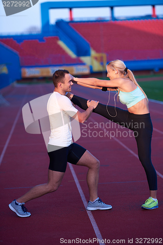 Image of sporty woman on athletic race track