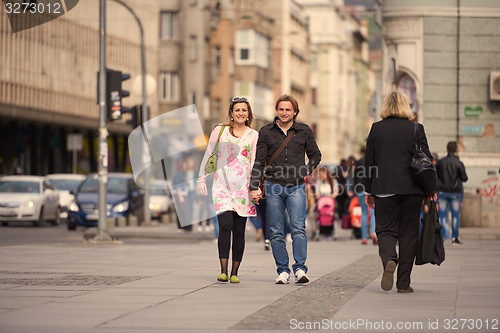 Image of young pregnant couple have fun and relax