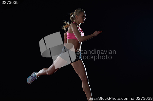 Image of Athletic woman running on track