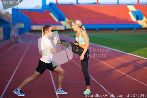 Image of sporty woman on athletic race track