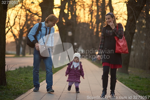 Image of young pregnant couple have fun and relax