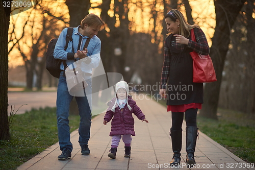 Image of young pregnant couple have fun and relax