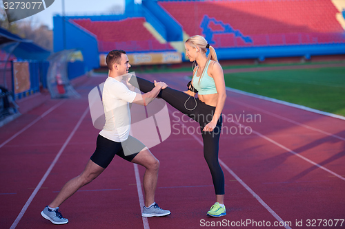 Image of sporty woman on athletic race track