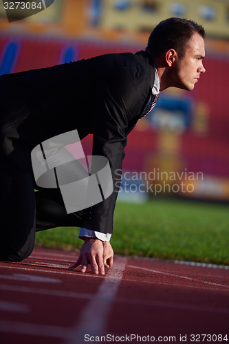 Image of business man ready to sprint