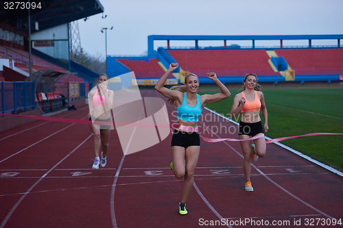 Image of Female Runners Finishing Race Together