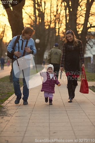 Image of young pregnant couple have fun and relax