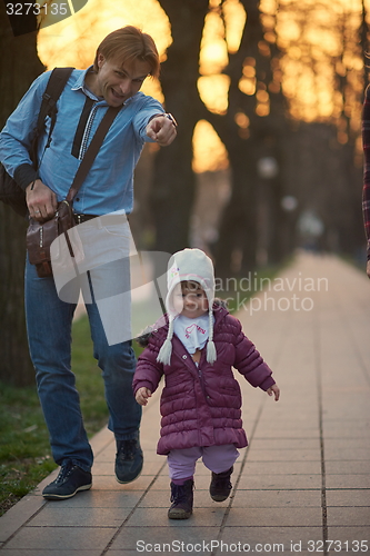 Image of young pregnant couple have fun and relax