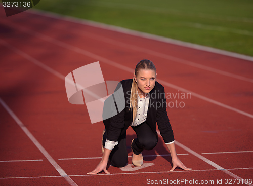 Image of business woman ready to sprint