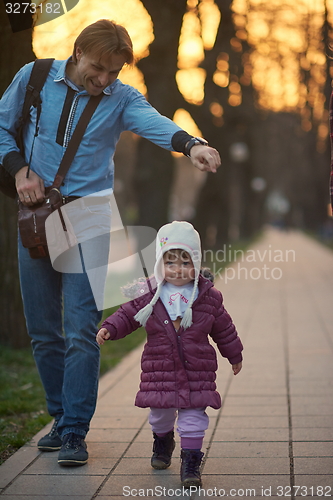 Image of young pregnant couple have fun and relax