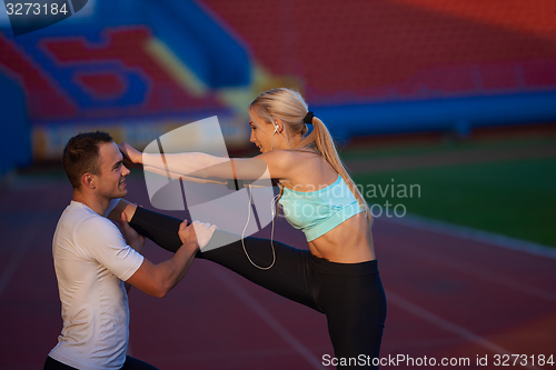 Image of sporty woman on athletic race track