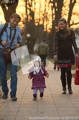 Image of young pregnant couple have fun and relax