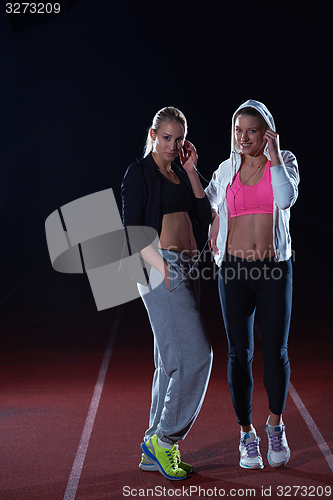 Image of sporty woman on athletic race track