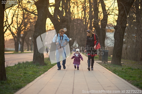 Image of young pregnant couple have fun and relax