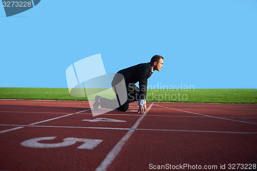 Image of business man ready to sprint