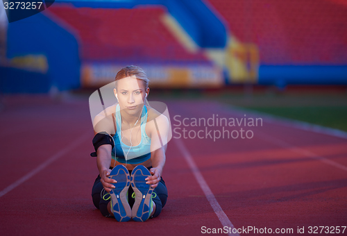 Image of sporty woman on athletic race track