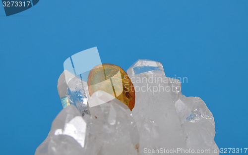 Image of Amber on rock crystal