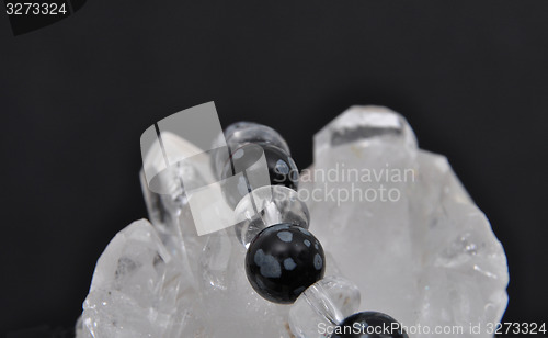 Image of Obsidian on rock crystal