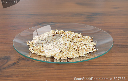 Image of Plate of glass with oat flakes