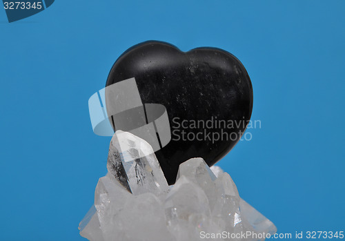 Image of Obsidian on rock crystal