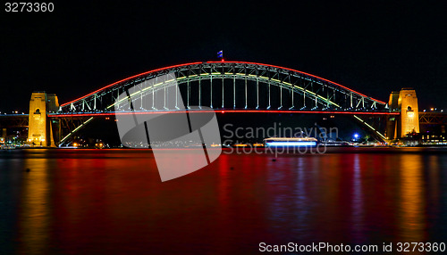 Image of Sydney Harbour Bridge ilights in red for Vivid Sydney Festival