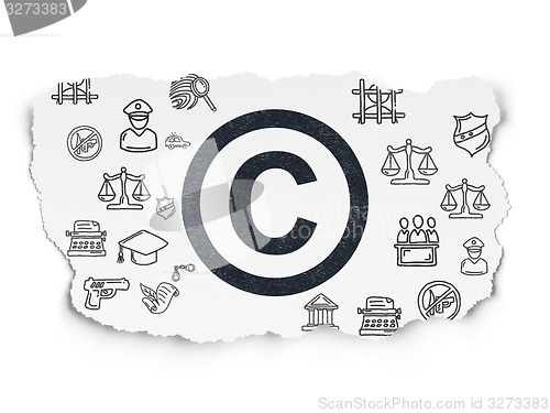 Image of Law concept: Copyright on Torn Paper background