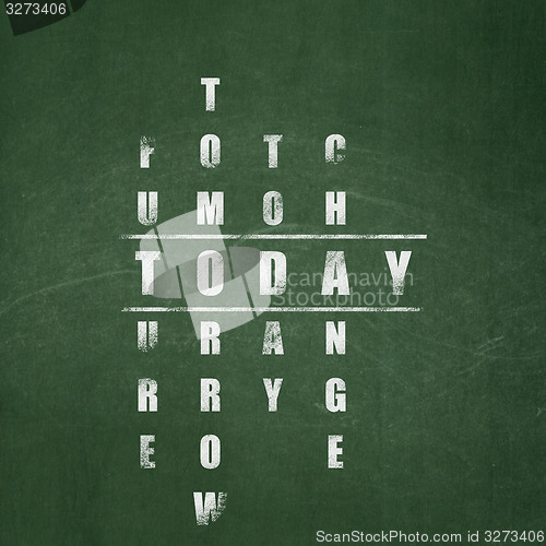Image of Time concept: word Today in solving Crossword Puzzle