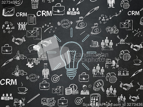 Image of Business concept: Light Bulb on School Board background