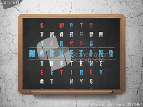 Image of Marketing concept: word Marketing in solving Crossword Puzzle