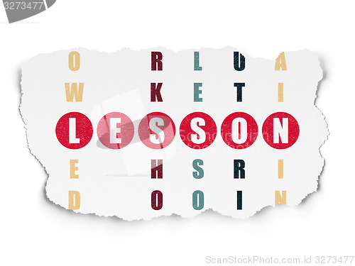 Image of Education concept: word Lesson in solving Crossword Puzzle