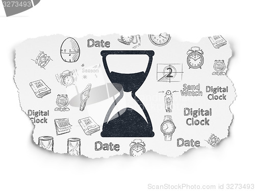 Image of Time concept: Hourglass on Torn Paper background