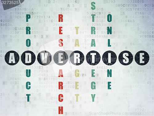 Image of Marketing concept: word Advertise in solving Crossword Puzzle