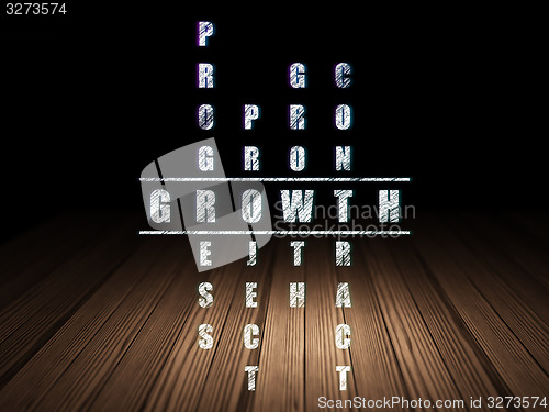 Image of Finance concept: word Growth in solving Crossword Puzzle