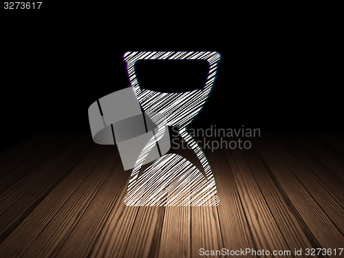 Image of Timeline concept: Hourglass in grunge dark room