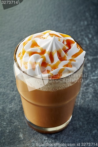 Image of glass of caramel latte with whipped cream