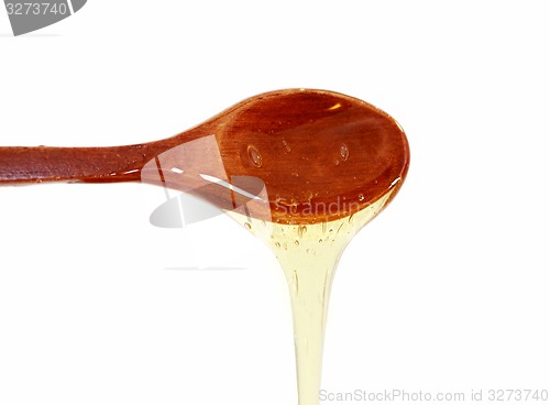 Image of Wooden spoon with honey 